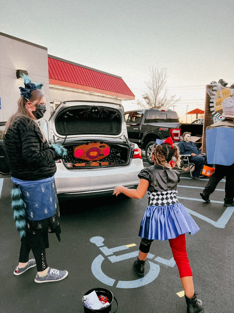 Trunk or treat event at Hardee's, Oct 2021. Little girl playing game.